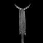 Silver chain necklace on a black background